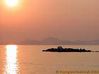 Pôr do sol sobre o continente, Hydra, Grécia.