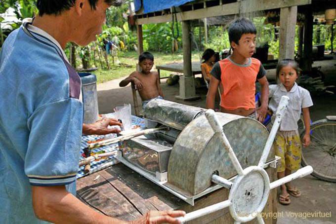 Sugarcane pressionando, Khone Ilha, Laos